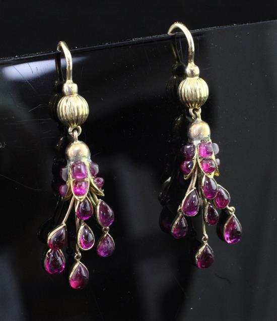 A pair of early 20th century gold and ruby drop earrings, 1.25in.